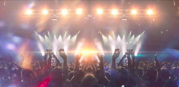istock Concert hall with people silhouettes 1202142463