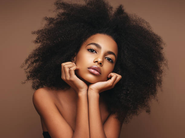 istock Beautiful smiling girl with curly hairstyle 1202143482