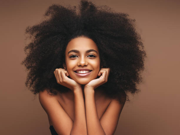 istock Beautiful smiling girl with curly hairstyle 1202143568