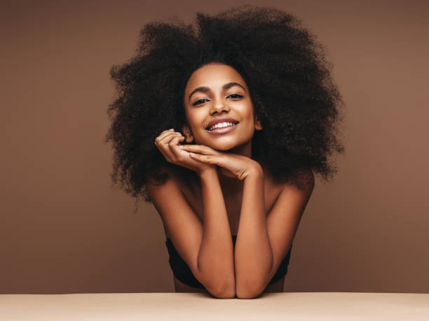 istock Beautiful smiling girl with curly hairstyle 1202143654