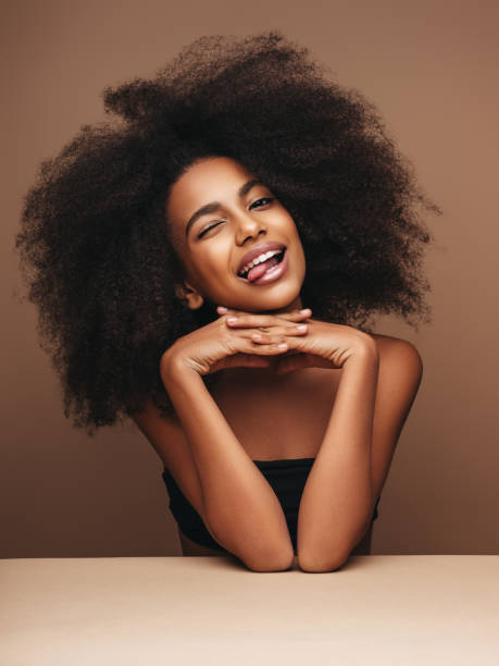 istock Beautiful smiling girl with curly hairstyle 1202143695