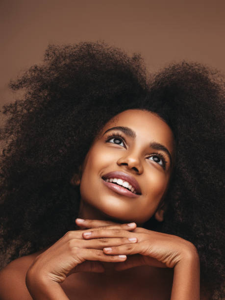 istock Beautiful smiling girl with curly hairstyle 1202143737