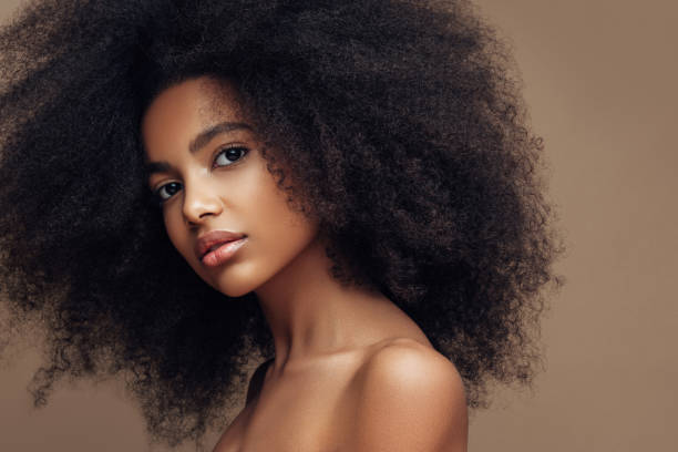 istock Beautiful smiling girl with curly hairstyle 1202143818