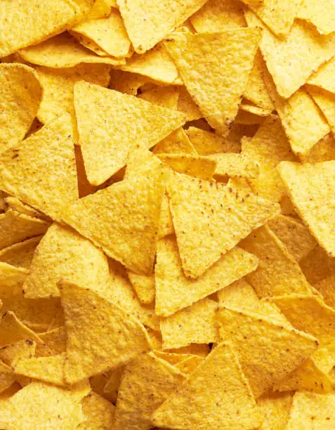Background of Mexican nachos chips, close up