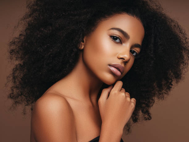 istock Beautiful smiling girl with curly hairstyle 1202144590