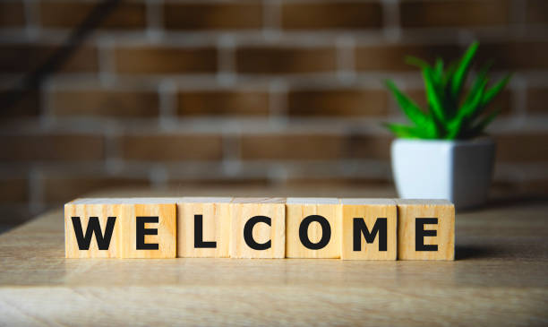 istock WELCOME word written on wood block, business concept. 1202145122