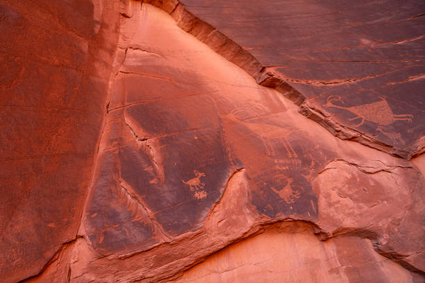 istock Ancient Petroglyphs in rock in Monument Valley, Utah 1202151980