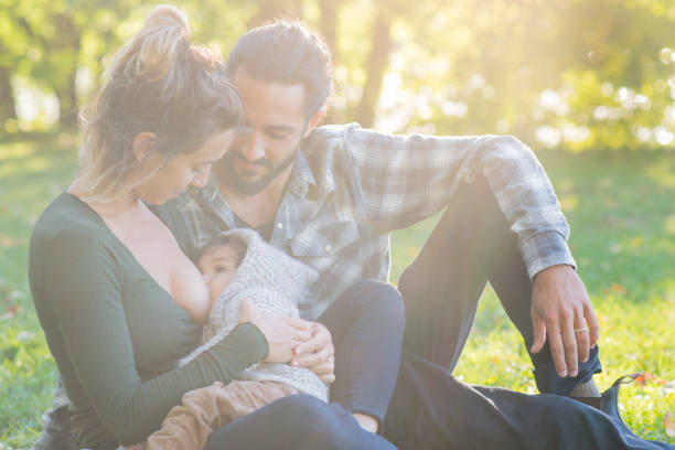 istock Mother Breastfeeding in the Park 1202152011