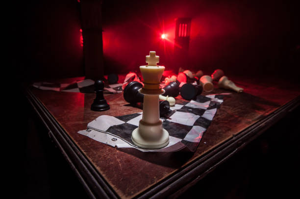 istock Chess figures on a dark background with smoke and fog. Selective focus 1202153872