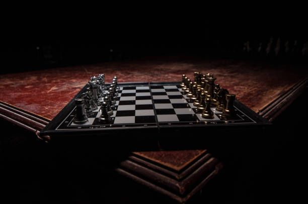 istock Chess figures on a dark background with smoke and fog. Selective focus 1202153938