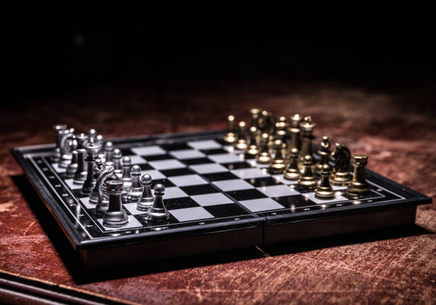 istock Chess figures on a dark background with smoke and fog. Selective focus 1202154491