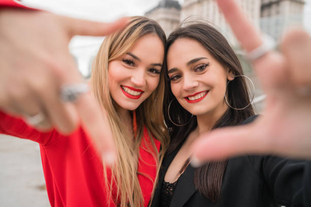 istock Two young friends spending good time together outdoors. 1202154825