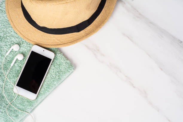 istock Smartphone, hat, sunscreen and towel. 1202154922