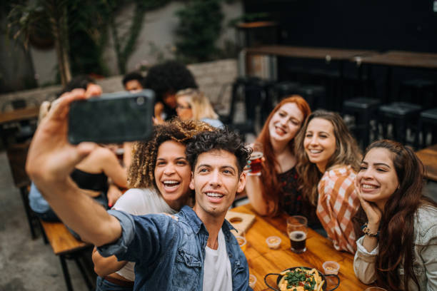 istock Friends taking selfie at the pub 1202158442