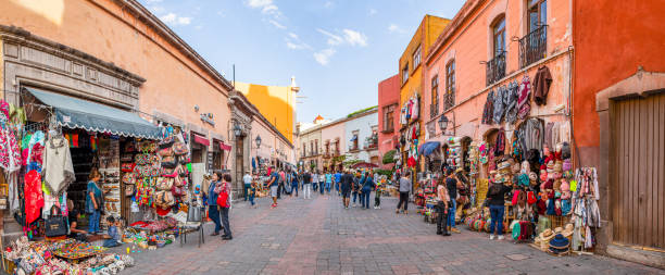 Santiago de Queretaro Santiago de Queretaro, Queretaro, Mexico - November 24, 2019: People enjoying the day among the artisanal shops at the andador 5 de mayo queretaro city stock pictures, royalty-free photos & images