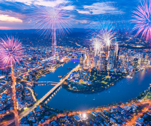 Brisbane Fireworks, Queensland, Australia Unique aerial panorama of the beautiful Brisbane Fireworks with the famous South Bank, Wheel, Botanical Garden and Skyscrapers. Converted from RAW. new year urban scene horizontal people stock pictures, royalty-free photos & images