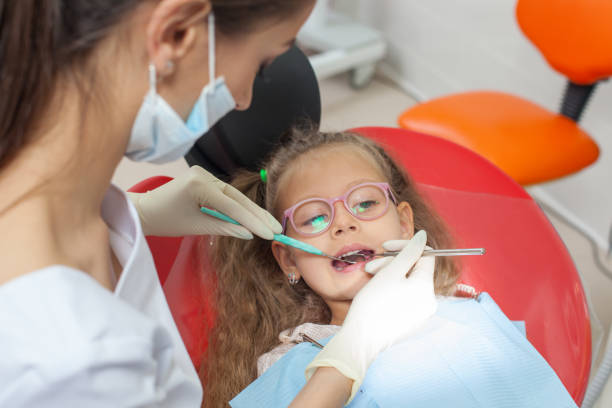 istock A child with a dentist in a dental office 1202170421