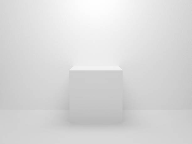 istock 3d exhibition stand. White blank empty podium isolated on gray background for presentation and exposition. Abstract 3d cube for mock up store. Pedestal for display product. Interior stage design. 1202173044