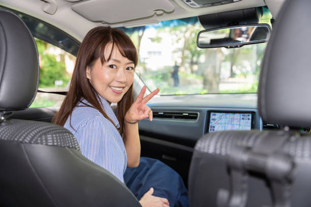 istock asian woman in a car 1202175116