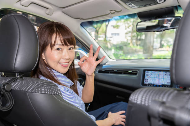 istock asian woman in a car 1202175150