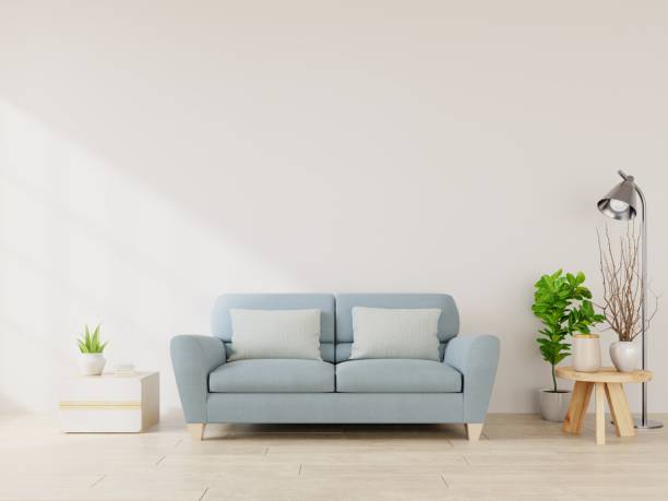 istock Modern living room interior with sofa and green plants,lamp,table on white wall background. 1202175331