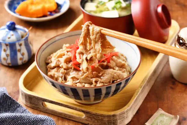 Gyudon - a bowl of rice with sliced beef, onion and sweet sauce.