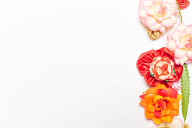 istock Frame made of rose flowers on white background. Top view with copy space. 1202179308