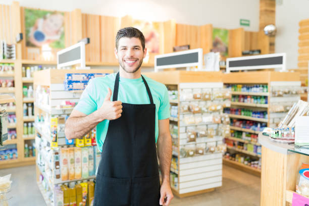 istock Confident Young Salesman In Supermarket 1202180270