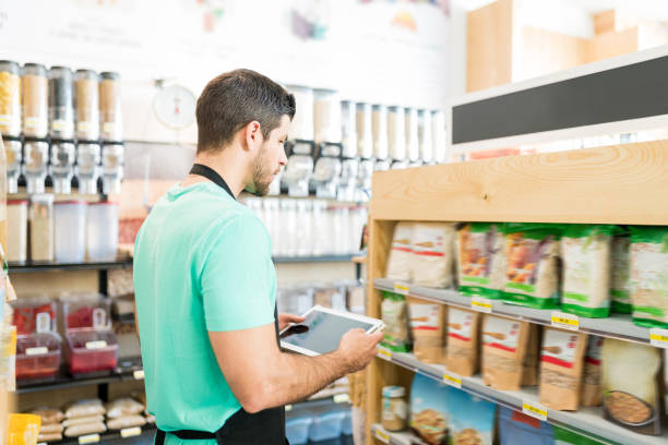 istock Salesman Checking Food Inventory In Store 1202180284