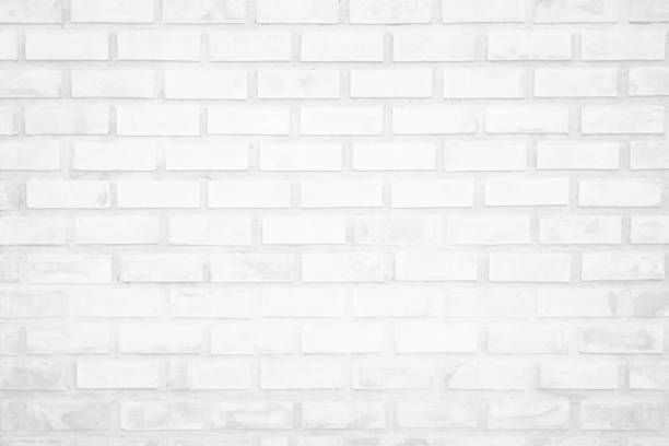 istock White brick wall texture background in room at subway. Brickwork stonework interior, rock old clean concrete grid uneven abstract weathered bricks tile design, horizontal architecture wallpaper. 1202181164