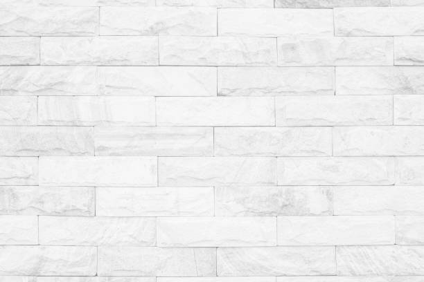 istock Medieval natural stone wall texture background or boundary the rock seamless abstract and decor fragment of design vintage wallpaper pattern chipped ancient from white color for interior copy space. 1202181165