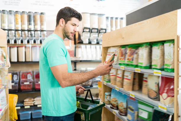 istock Male Customer Shopping In Grocery Store 1202181309