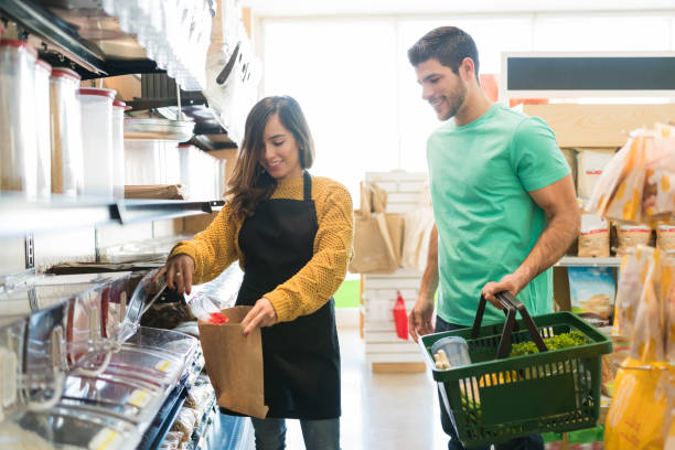 istock Buyer Standing By Grocery Store Worker 1202181328