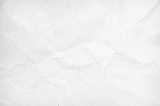 White recycled craft paper texture as background. Grey paper texture, Old vintage page or grunge vignette of old newspaper. Pattern rough art creased grunge letter. Hardboard with copy space for text.