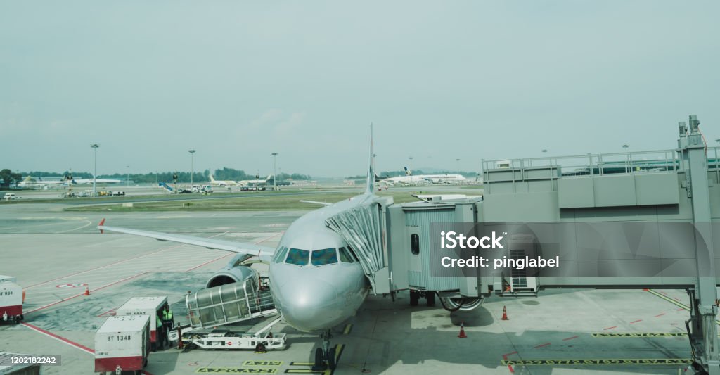 airport view with airplanes and service vehicles Airport Stock Photo