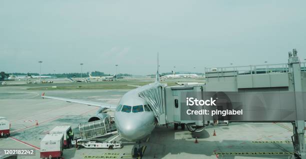 Airport View With Airplanes And Service Vehicles Stock Photo - Download Image Now - Airport, Architecture, Asia