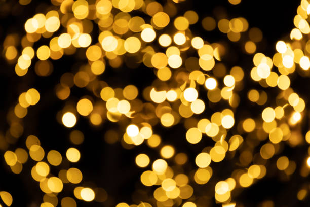 istock abstract background of defocused bokeh yellow night small circle light bulb 1202184018