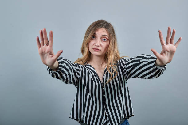istock Disappointed woman showing palms at camera, unhappy 1202189206