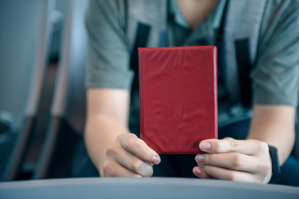 istock Asian boy holding passport 1202189988