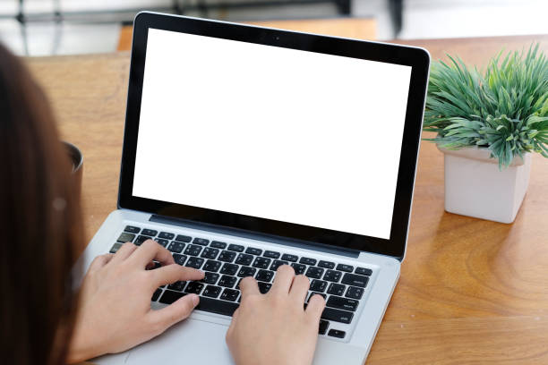 istock Laptop mock up, Woman hands typing computer with blank screen for template background, Laptop with blank screen backdrop for people and business, e commerce,  technology , online education, e learning, and internet of things 1202191549