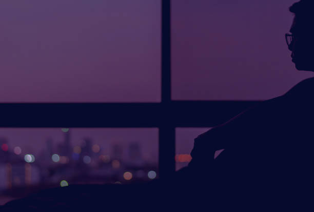 istock A man sitting on his bed alone at night. 1202193969