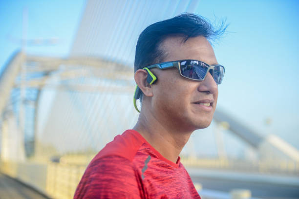 istock Asian sportsman making preparation before a morning run 1202194280