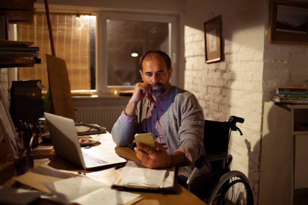 istock Mature man using a phone in his office 1202195605