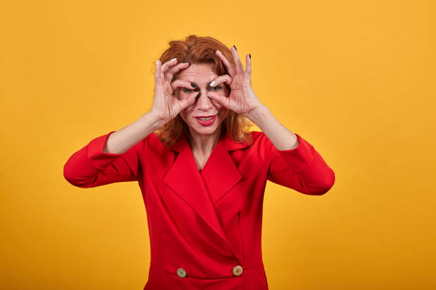 istock Attractive caucasian young woman doing binocular, glasses gesture on eyes 1202200925