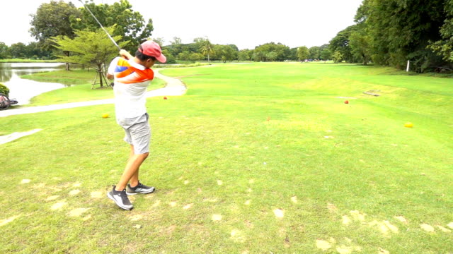 Golfer hitting golf ball on Beautiful Golf Course