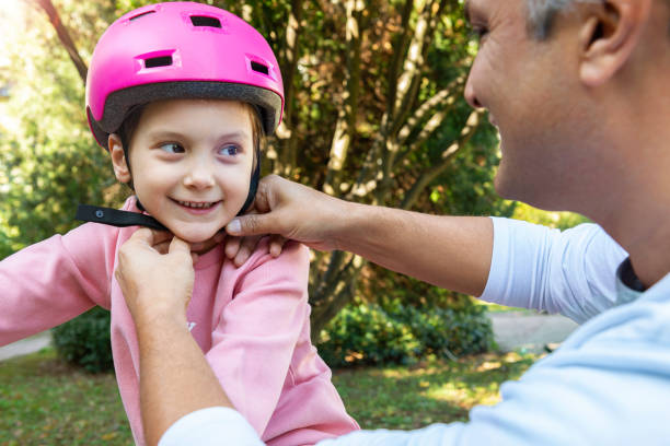 istock Father and Daughter with Bicycle 1202202458
