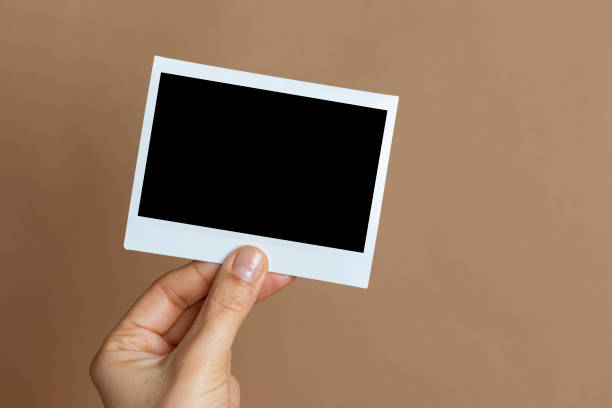 istock Hand Holding Instant Photo 1202202582