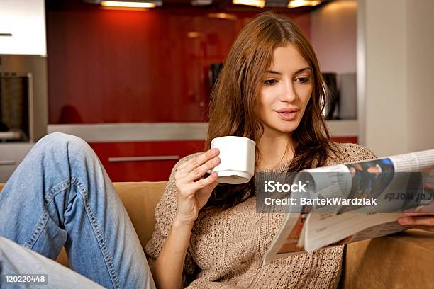 Woman Drinking Coffee And Reading News Stock Photo - Download Image Now - Domestic Life, Tracksuit, 20-24 Years