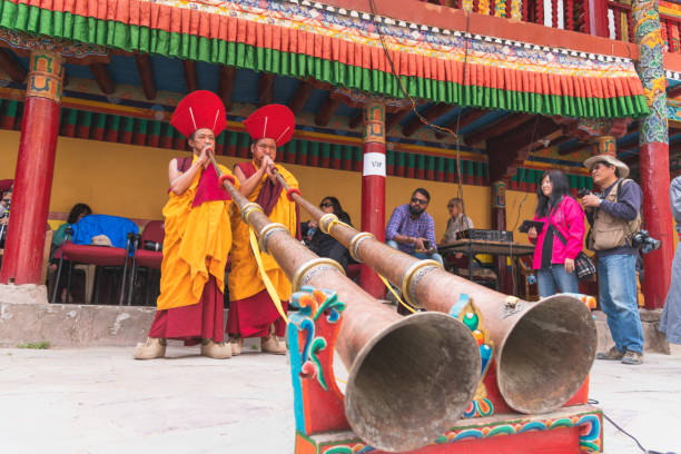 Ladakh,India July 12,2019 :Traditional artists perform Cham dance \n (masked danc is some sects of Buddhists) during Diskit Festival at Diskit monastery in Diskit,Ladakh, India.
