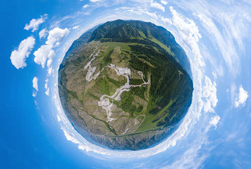 Aerial  panoramic view of planet earth near a Chike-Taman pass in the Altai mountains with green trees, Blue sky and clouds. Full VR 360 Degree Aerial Panorama Seamless Spherical